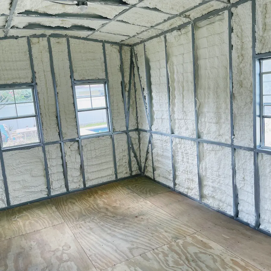 Closed-cell spray foam insulation applied to wall cavities in a residential project in Wilton